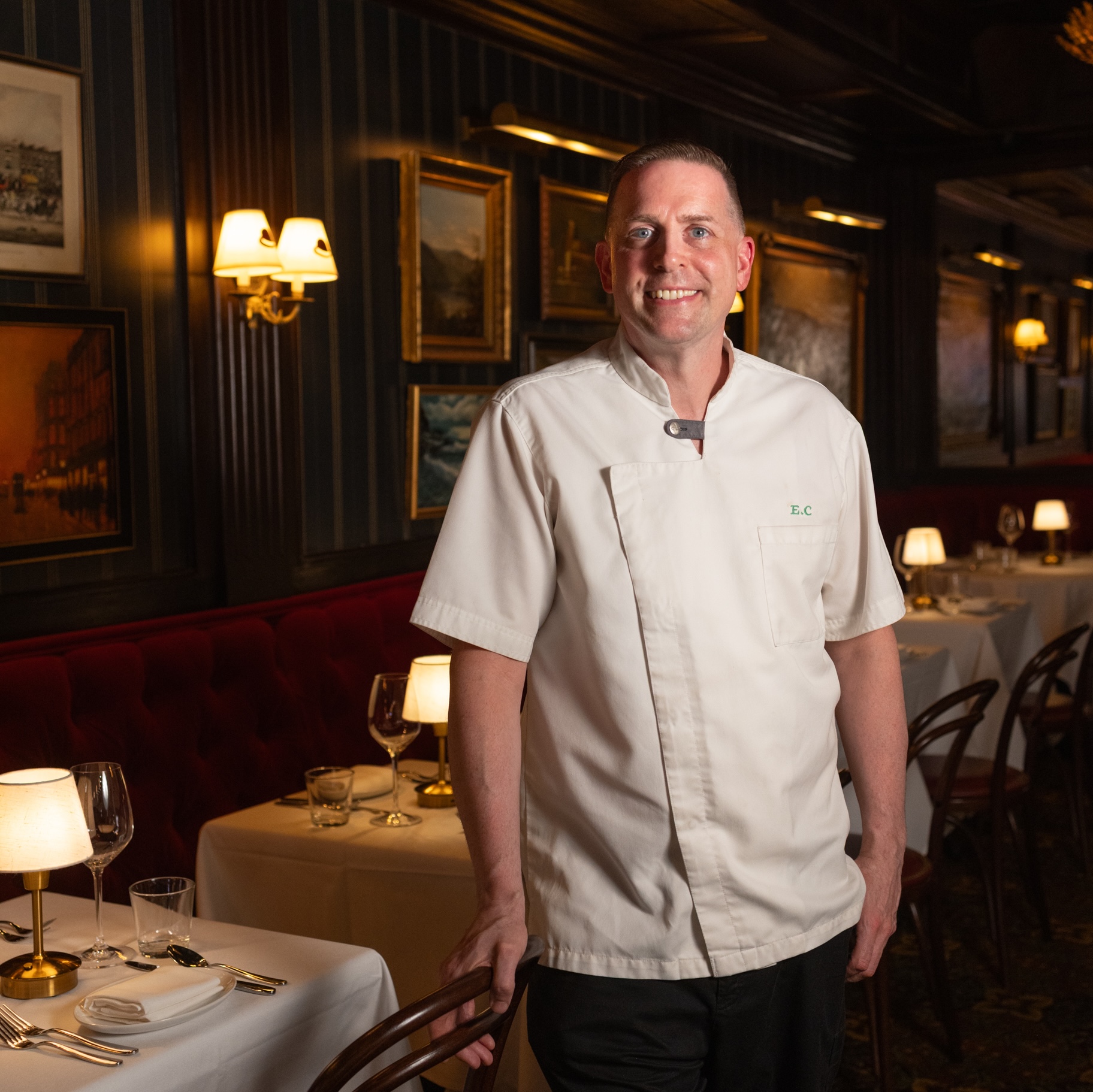 a man standing in a restaurant