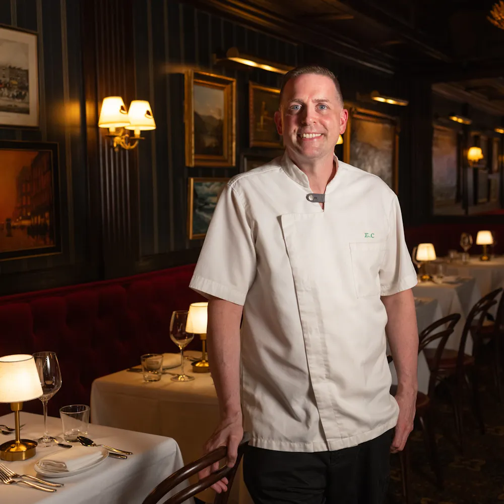 a man standing in a restaurant