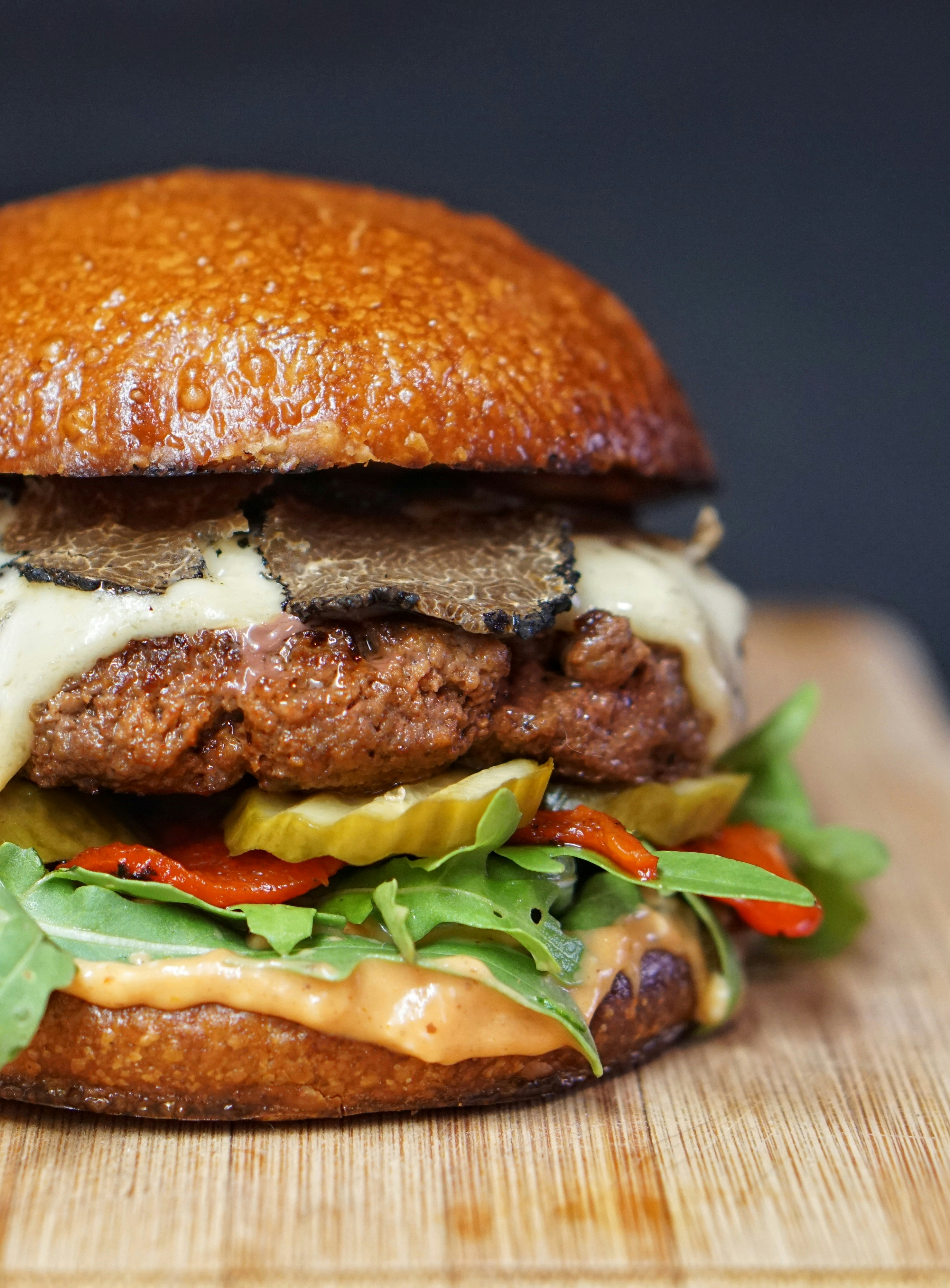 a close up of a sandwich sitting on top of a wooden table