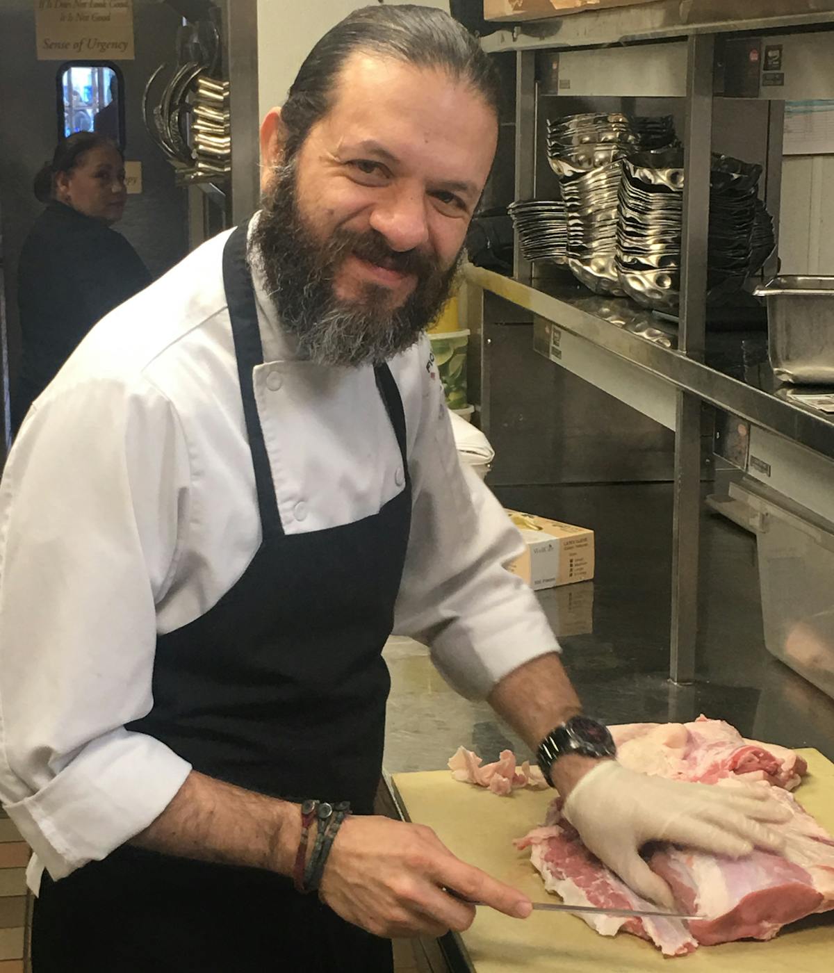 a man preparing food in a kitchen