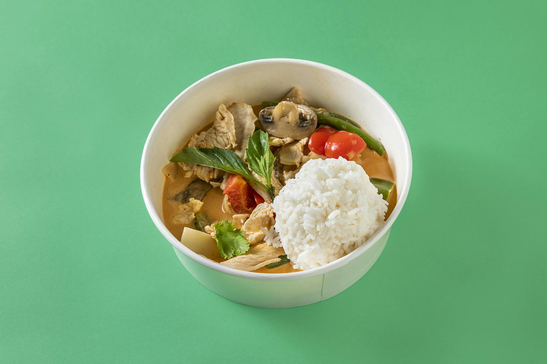 a bowl of noodles topped with veggies and rice