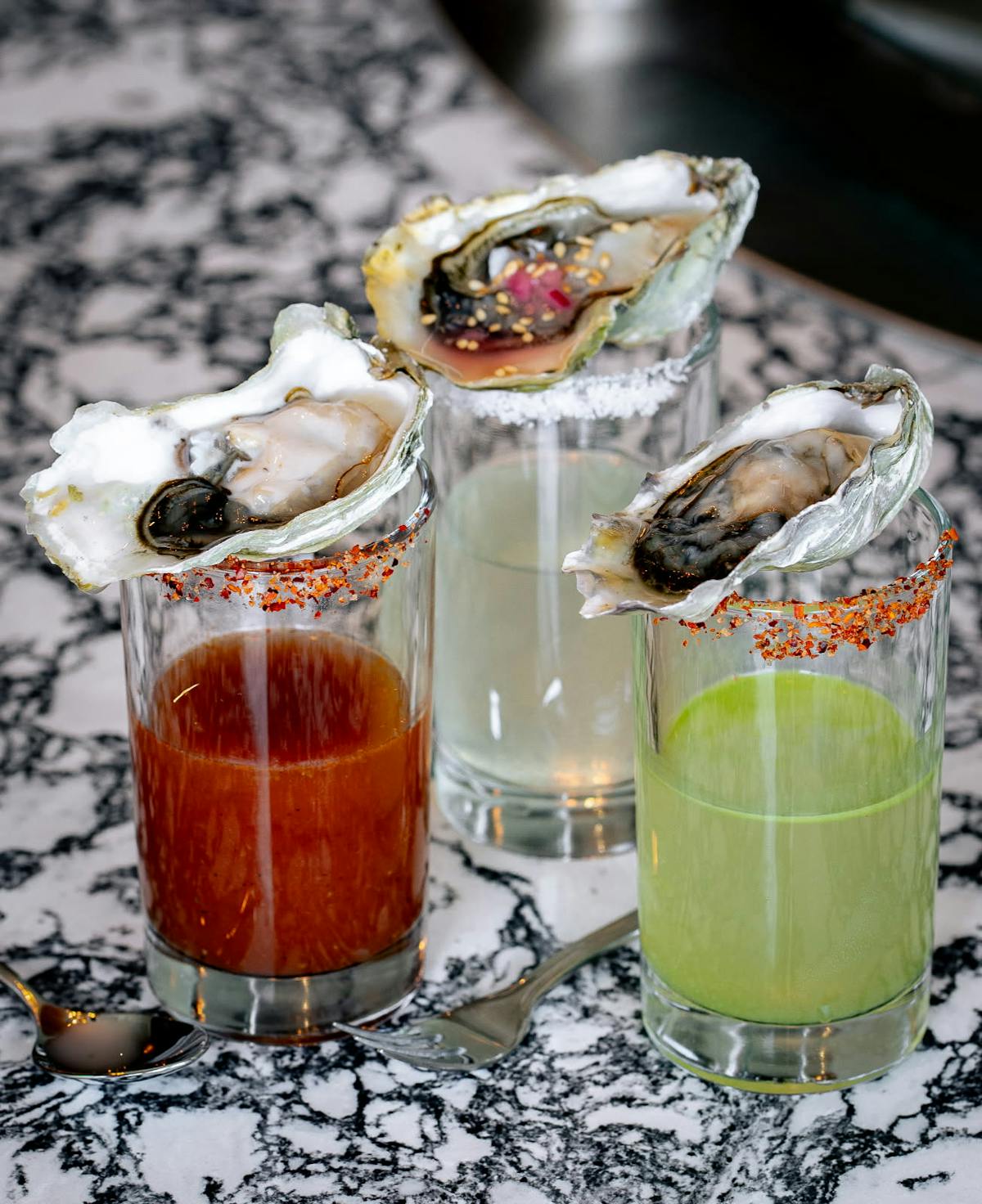 Oyster cocktail shooters served at Outcast Fish & Oyster Bar in New Albany