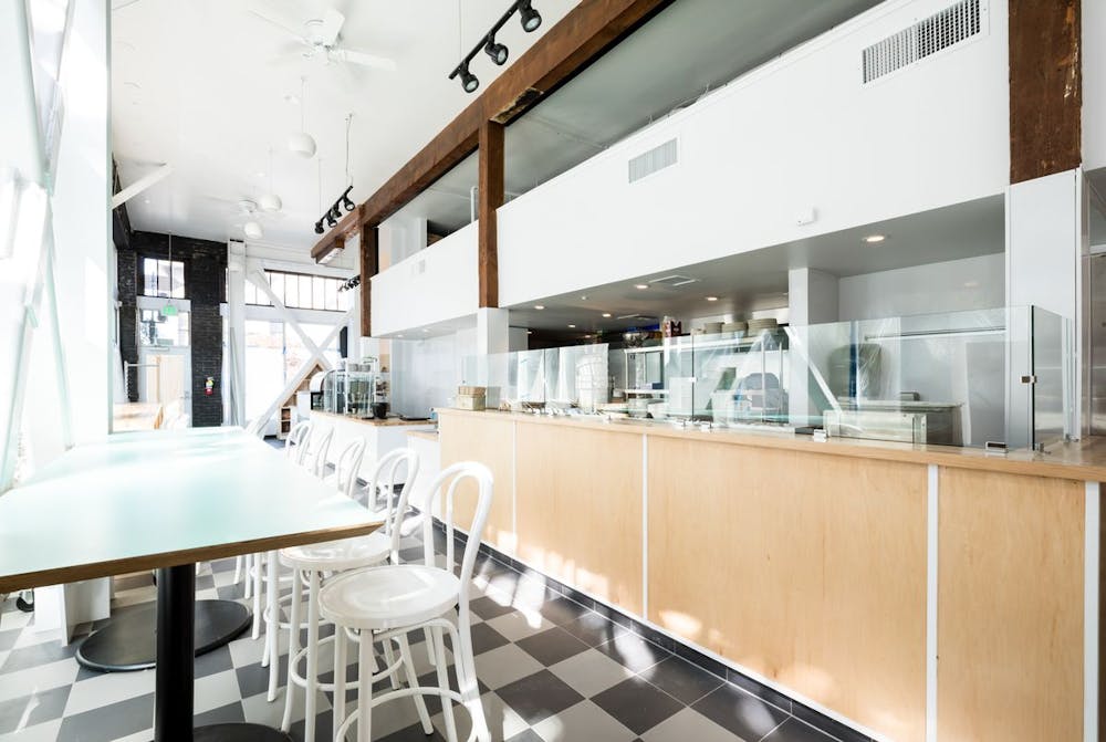 a kitchen with a table in a restaurant