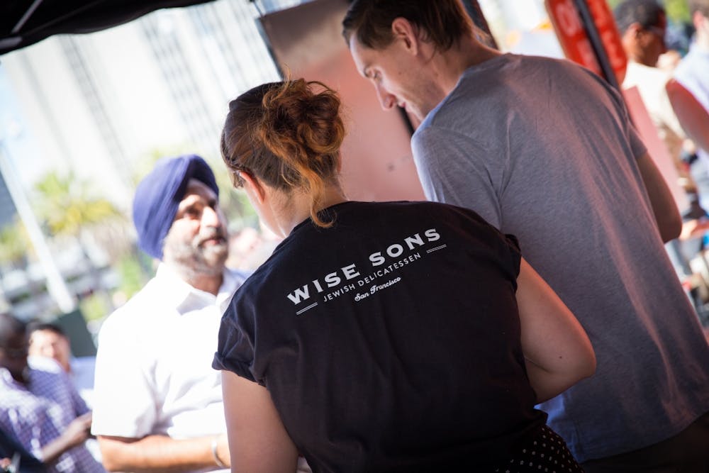 a group of people looking at a phone