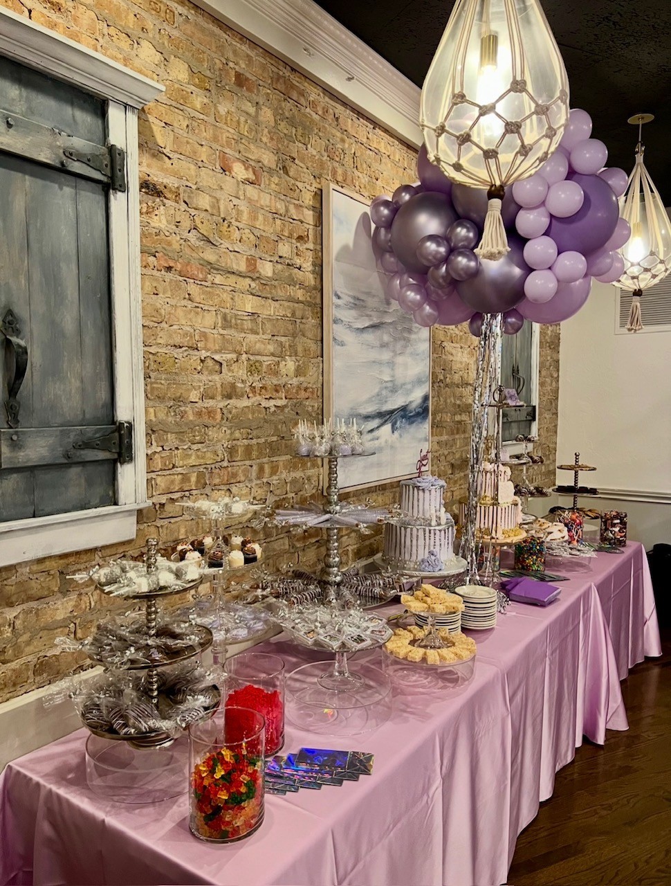 a table with food and balloons