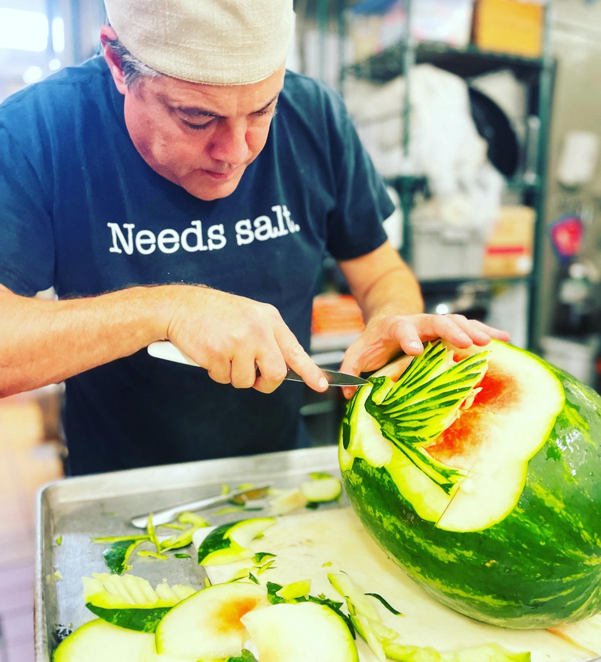 a man cutting food on a table