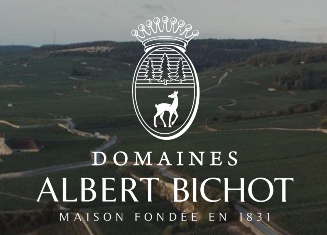 a landscape with a road and a logo