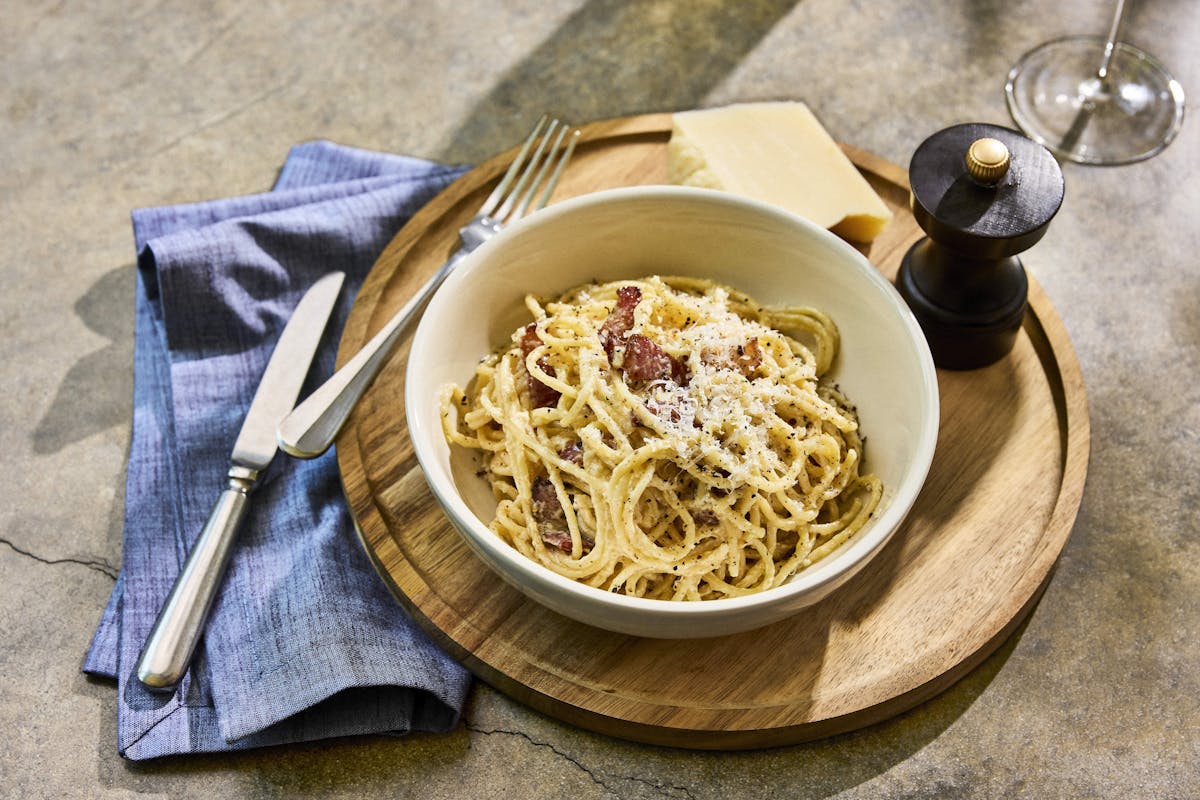 a bowl of food sitting on a table