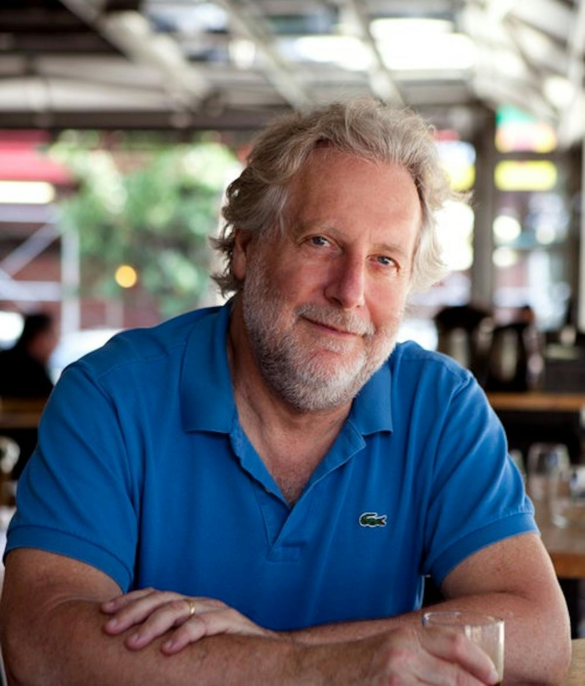 Jonathan Waxman sitting at a table