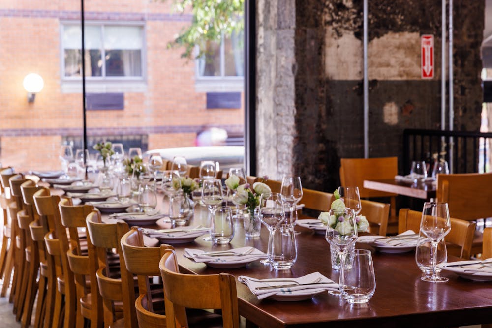 a dining table filled with wine glasses