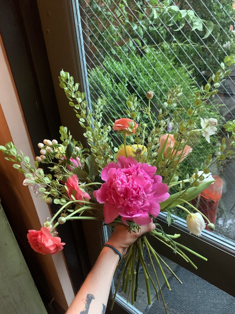 a vase filled with pink flowers on a table