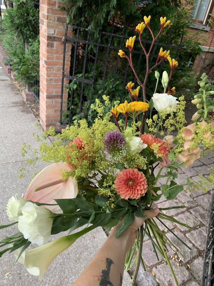 a vase of flowers on a plant