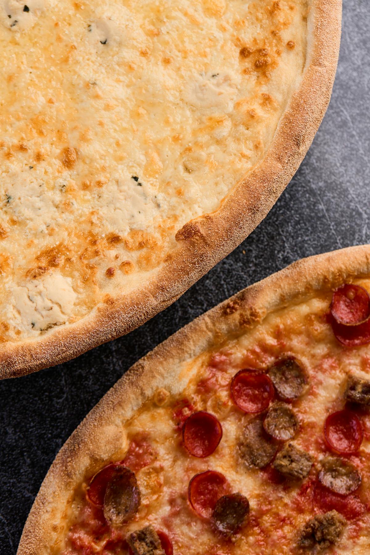 a pizza sitting on top of a pan on a table