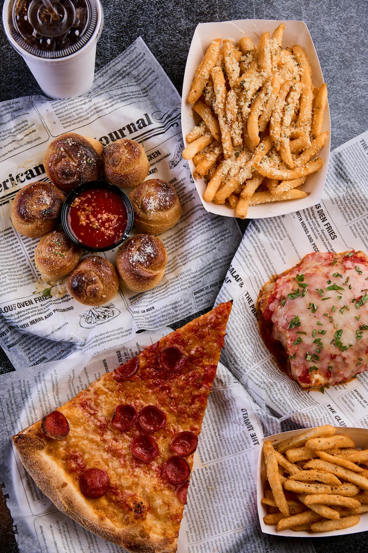 a plate of hot dogs and fries on a table