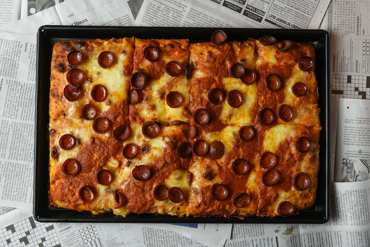 a pizza sitting on top of a table
