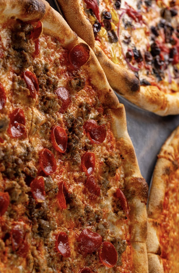 a close up of a slice of pizza