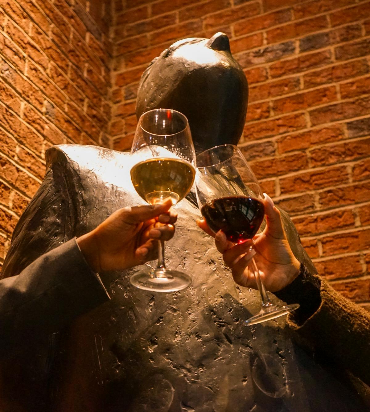 a person drinking a glass of wine