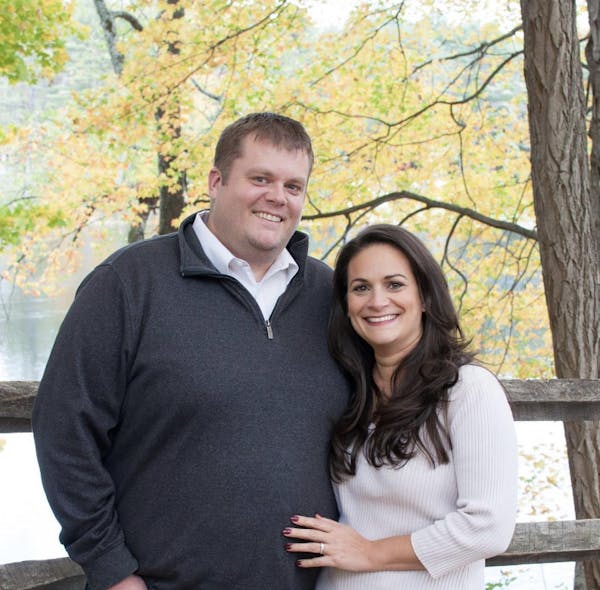 a man and a woman posing for a picture