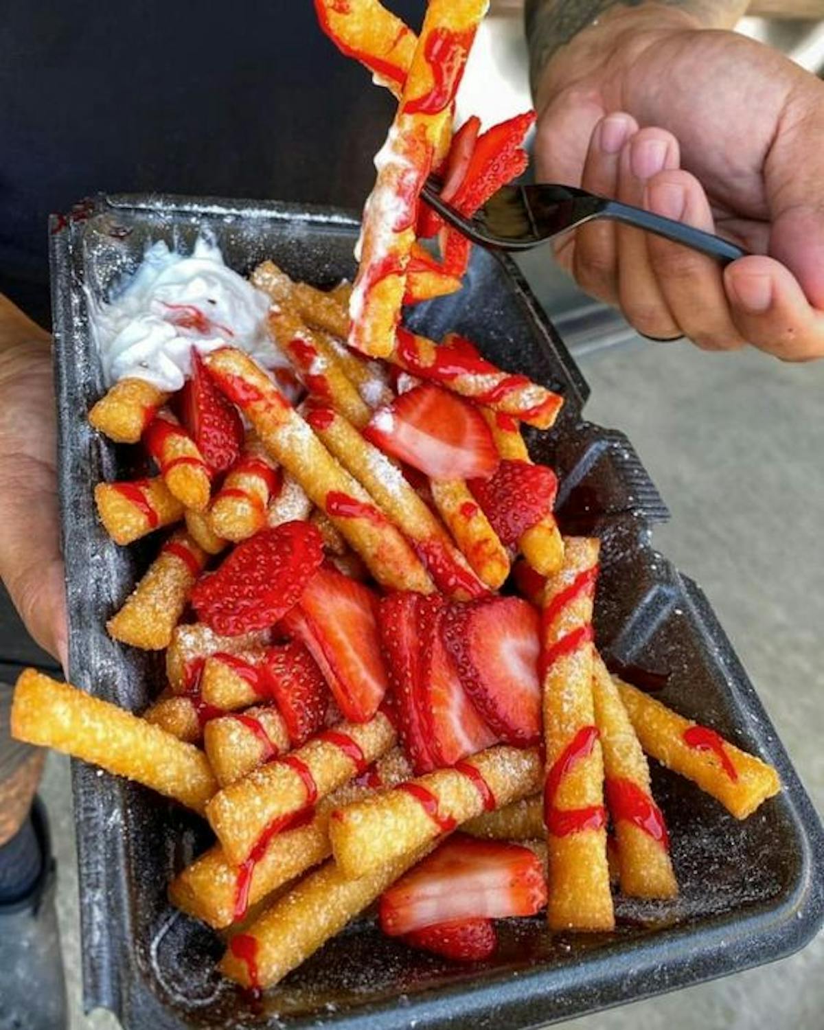 Strawberry Funnel Cake Friesa tray of food