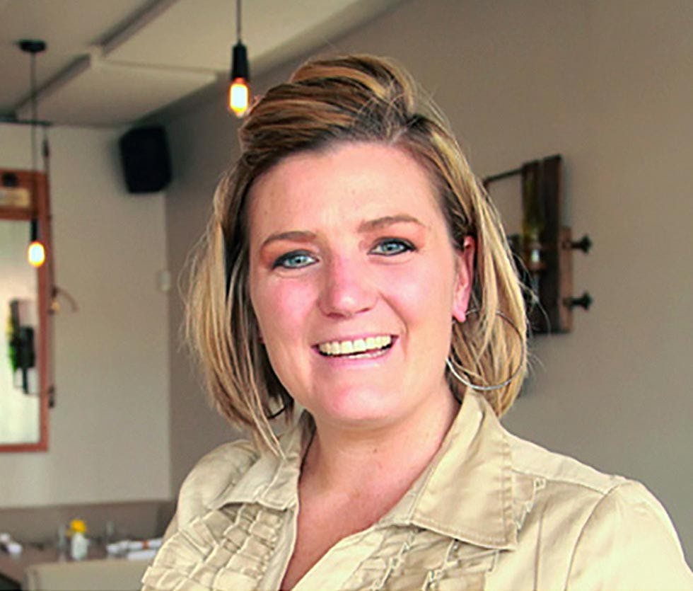 a woman smiling for the camera