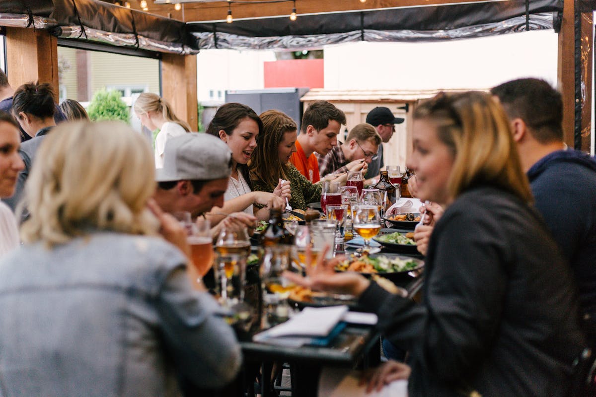 a group of people sitting at a table