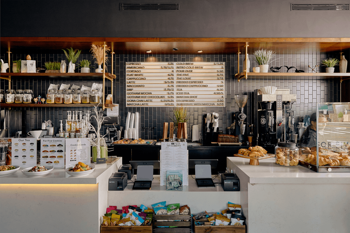 a kitchen with a table in a restaurant