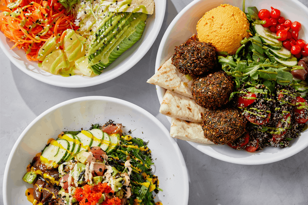a bowl filled with different types of food on a plate