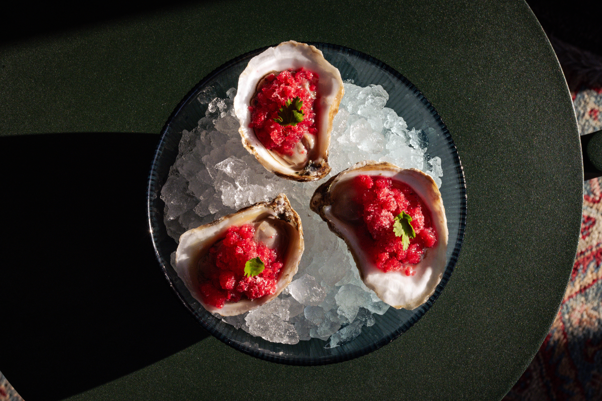 a cake with fruit on top of a table