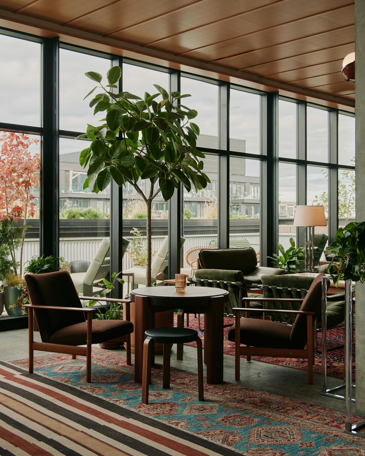 a living room filled with furniture and a large window