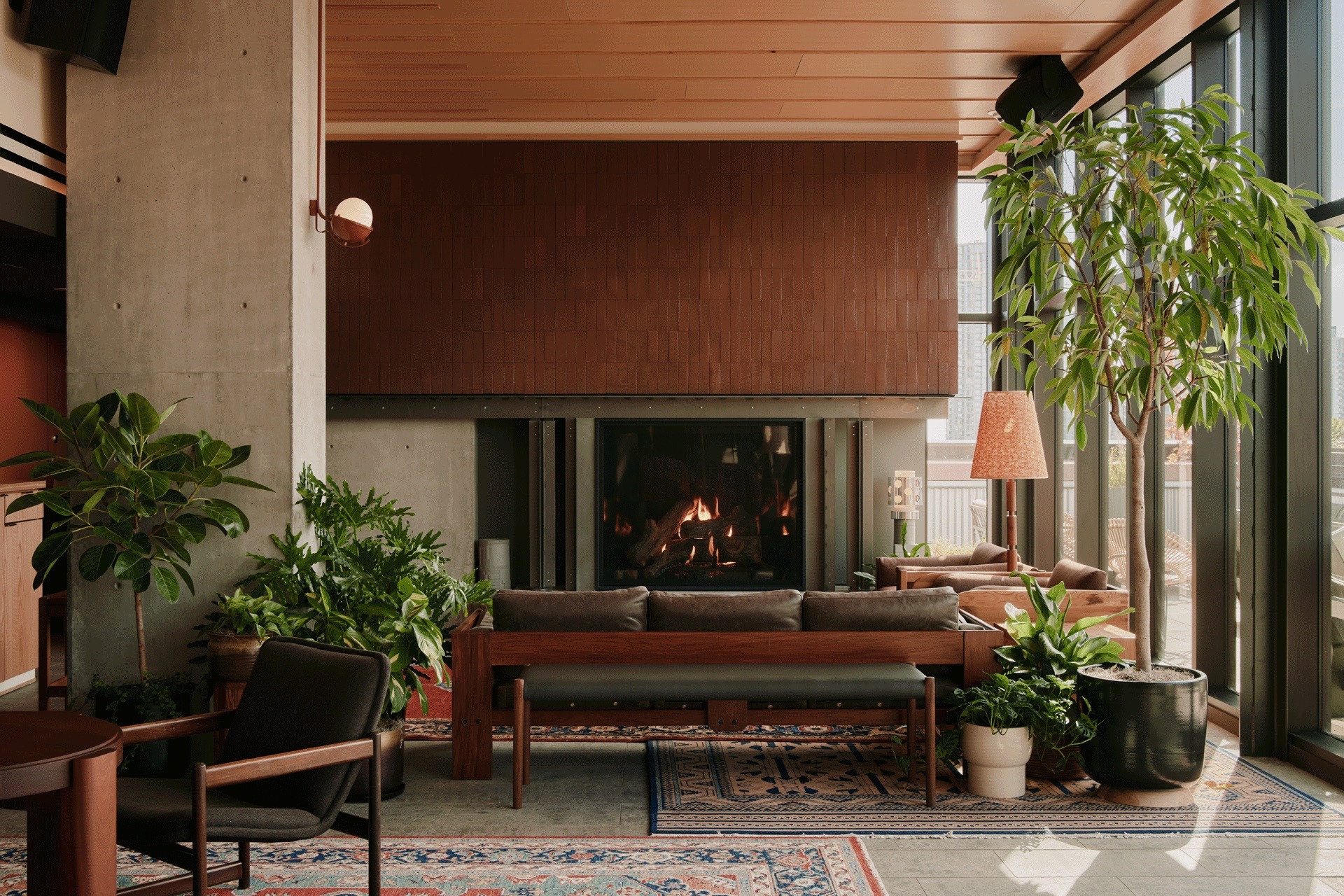 a room filled with furniture and vase of flowers on a table