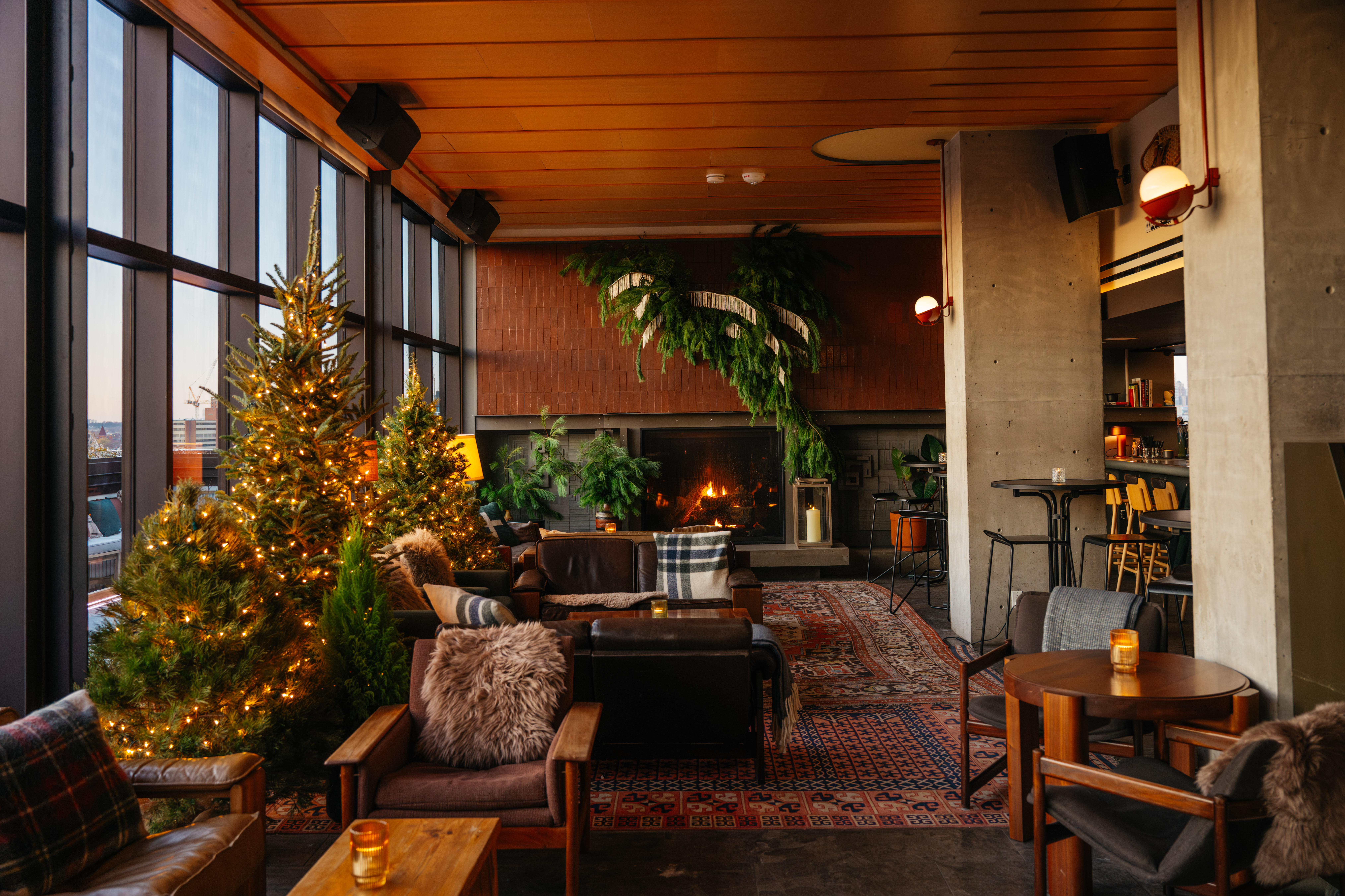 a room filled with furniture and vase of flowers on a table