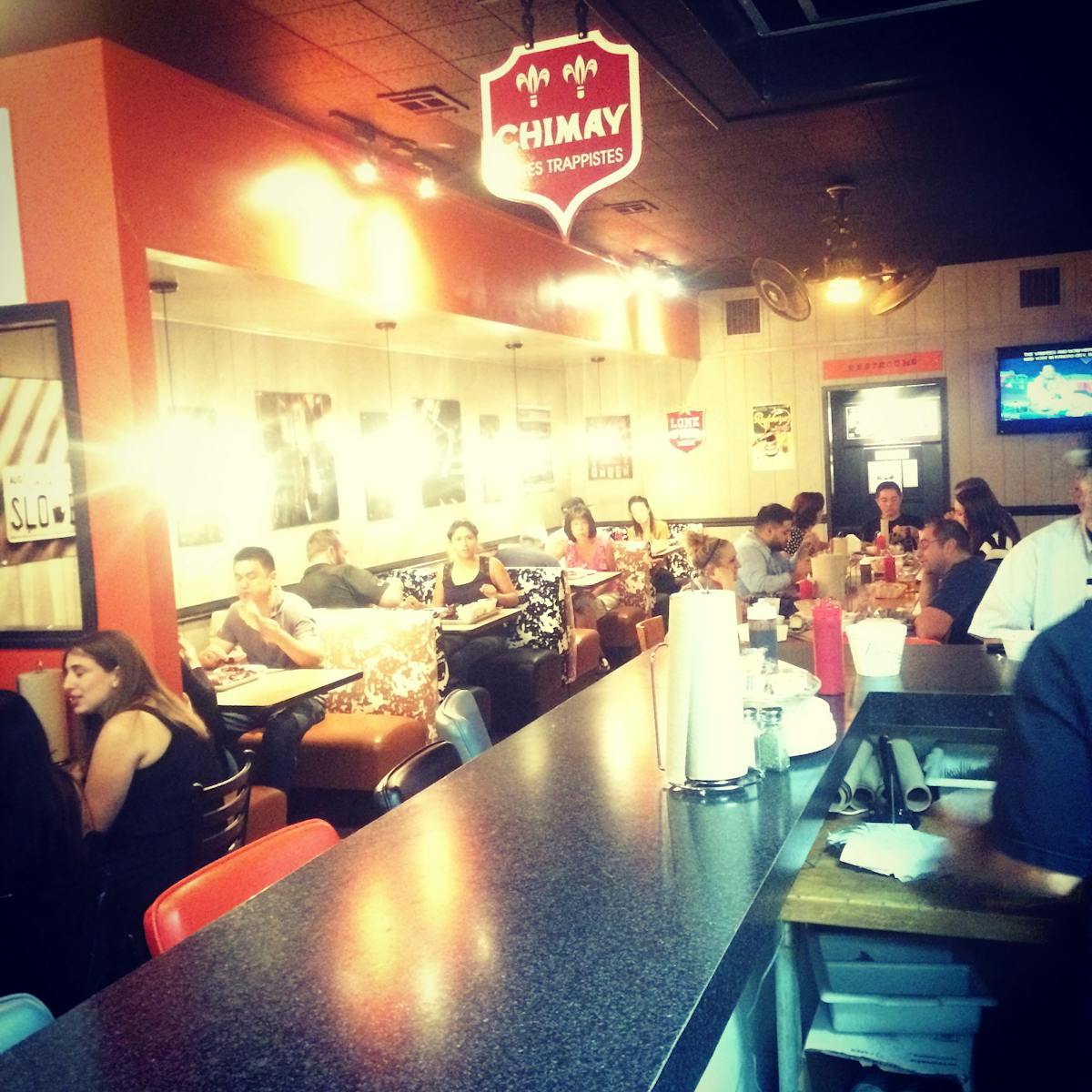 a group of people sitting at a table in a restaurant