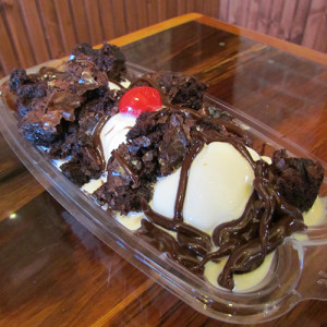a cake with fruit on top of a wooden table