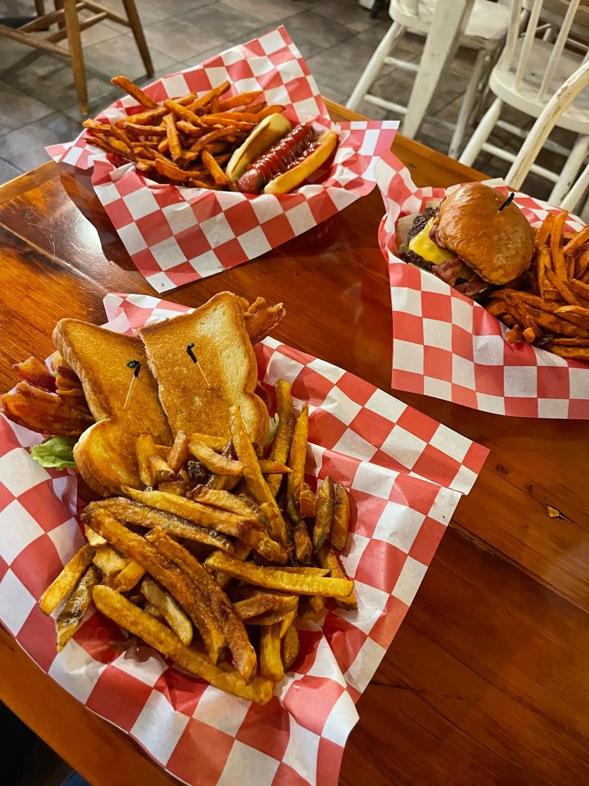 a hot dog and fries on a table