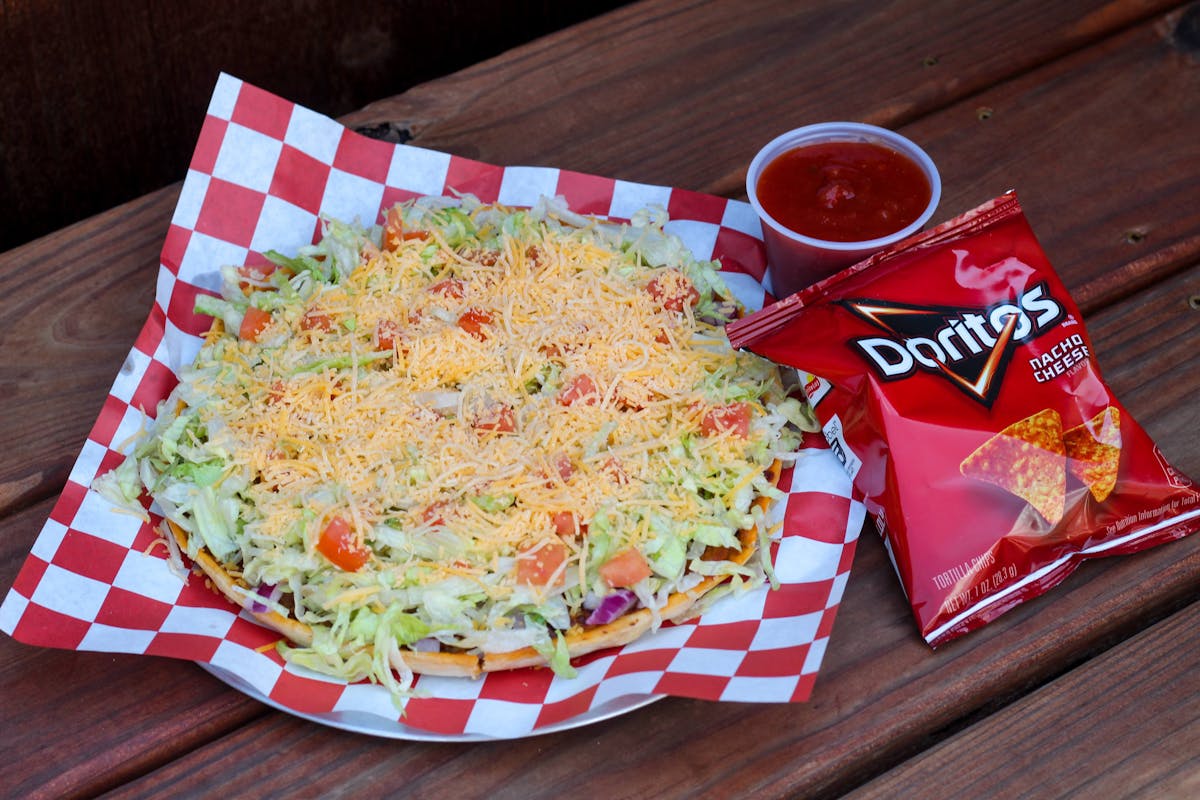 a plate of food sitting on top of a wooden table