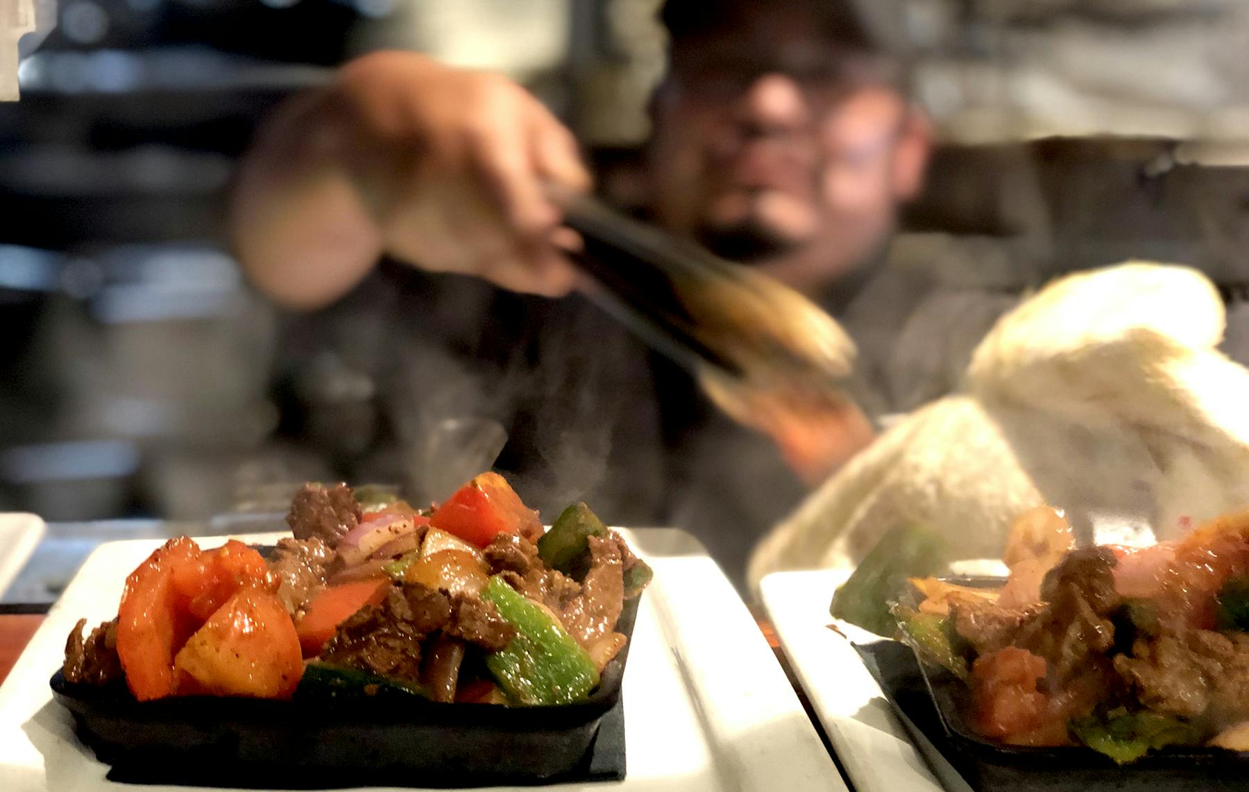 a person holding a plate of food