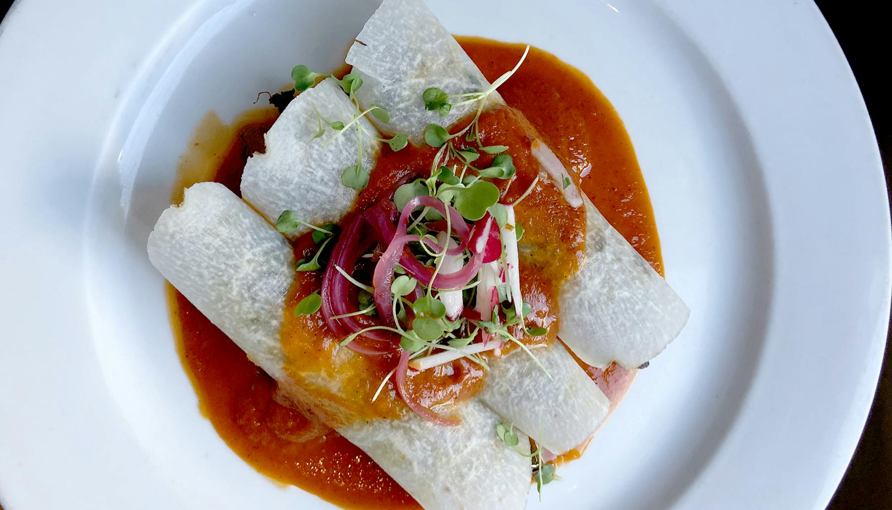 a plate of food with a slice cut out