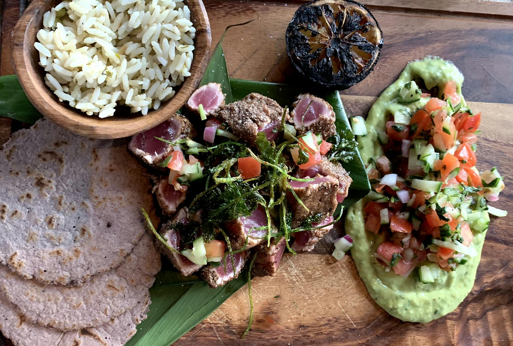 a salad sitting on top of a wooden table