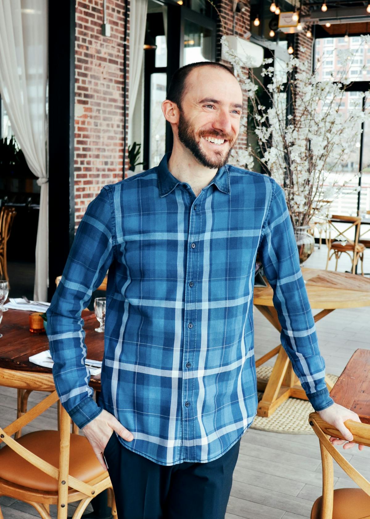 a man standing in front of a building