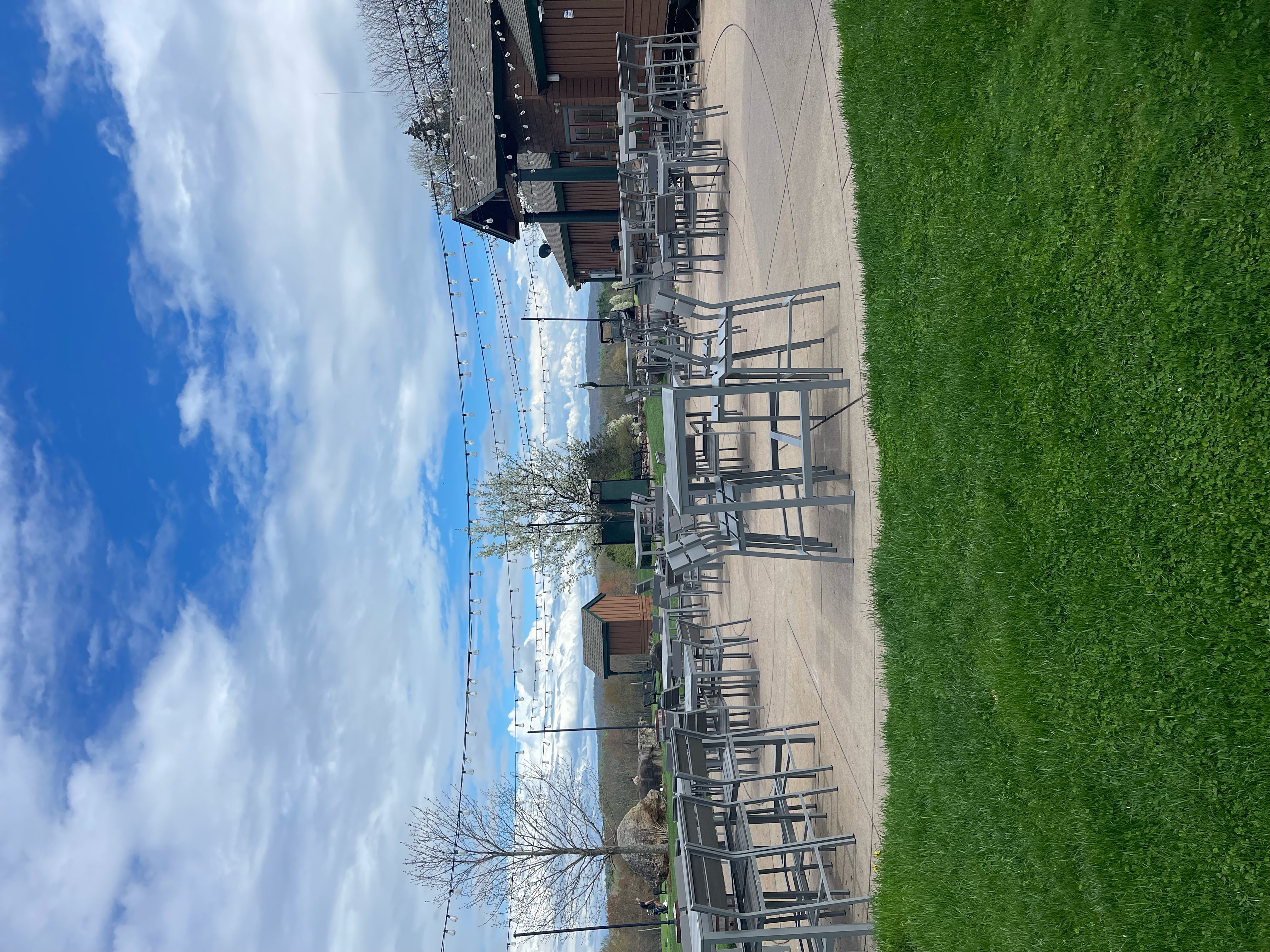 a group of tables and chairs outside a building