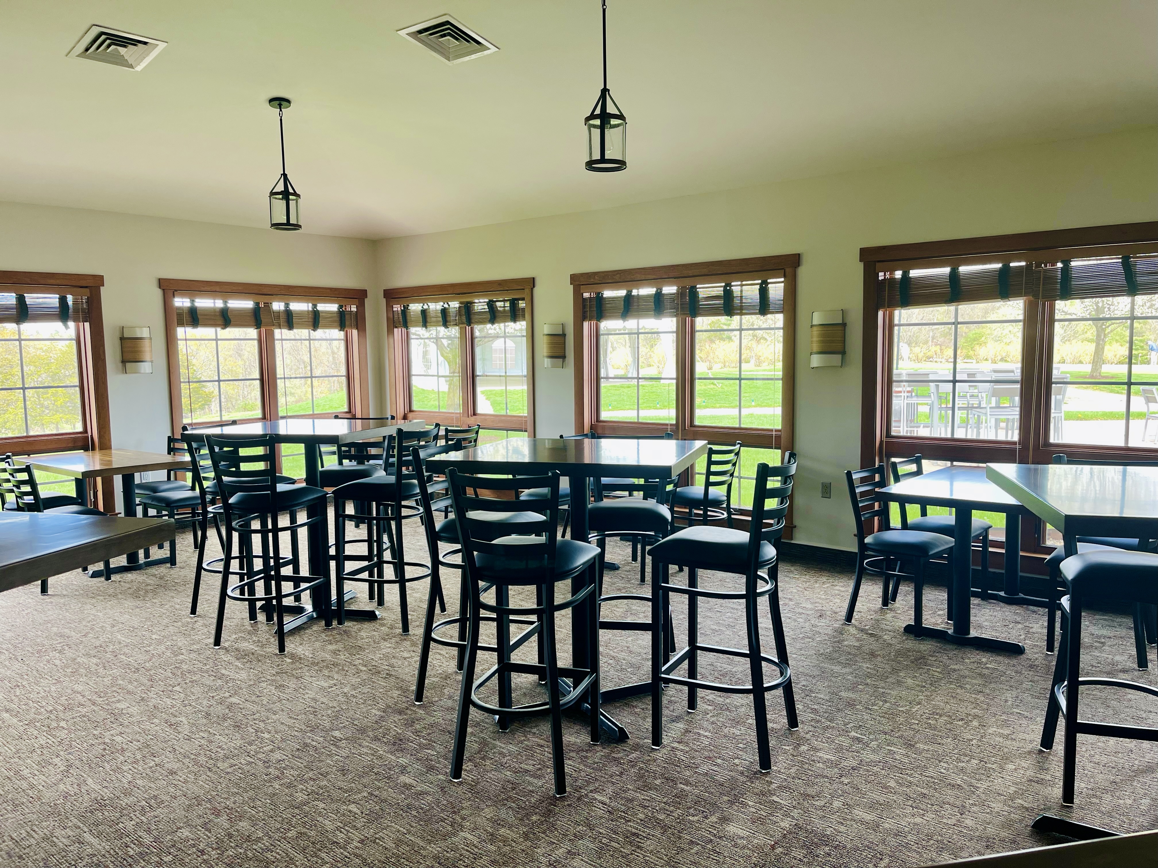 a room with tables and chairs