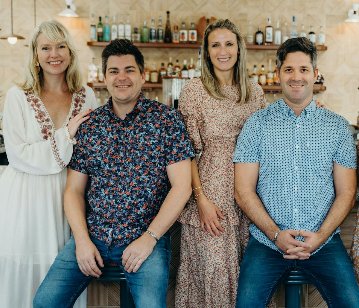 a group of people posing for a photo