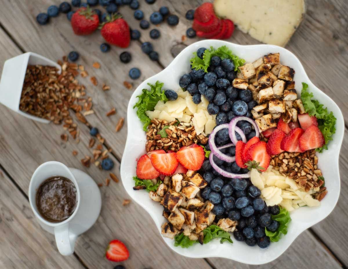 a bunch of food sitting on top of a wooden table