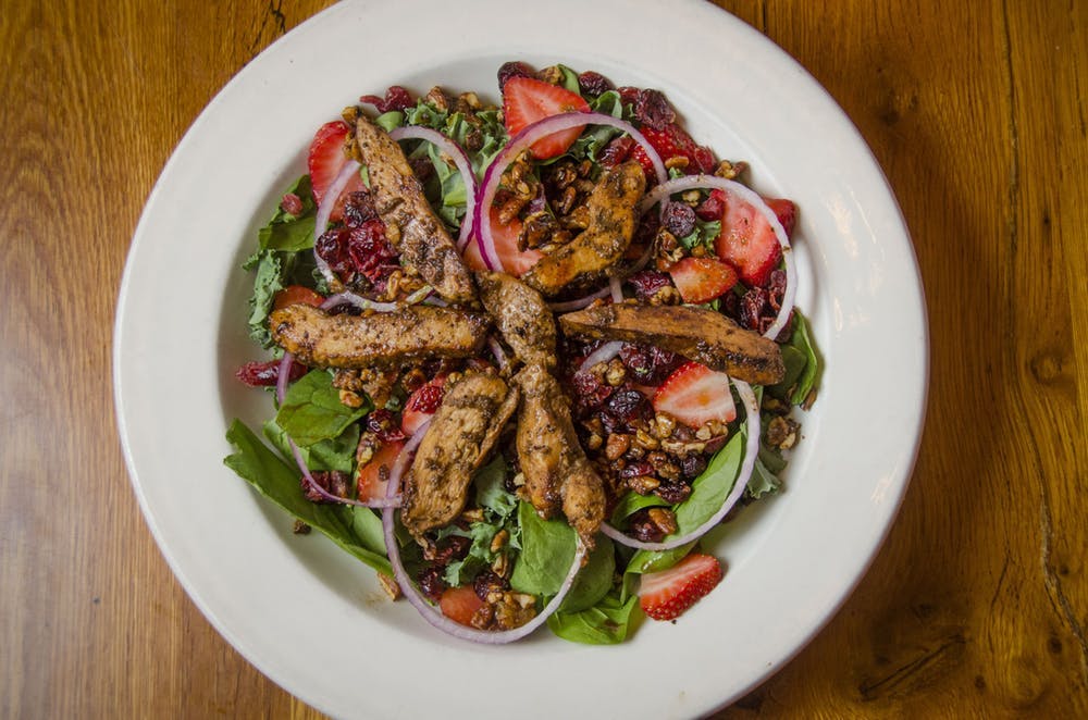 a bowl of salad on a plate