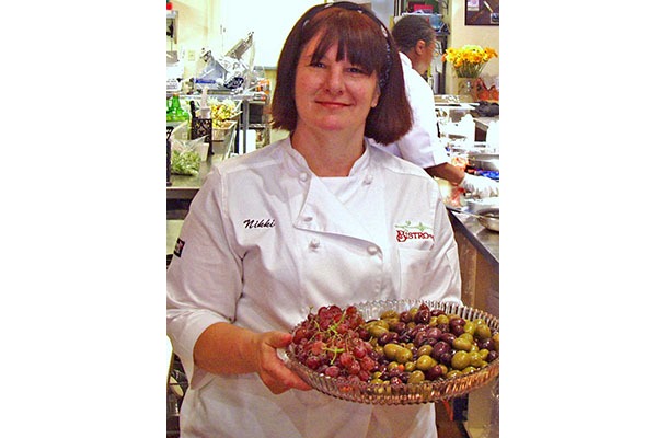 a person holding a plate of food