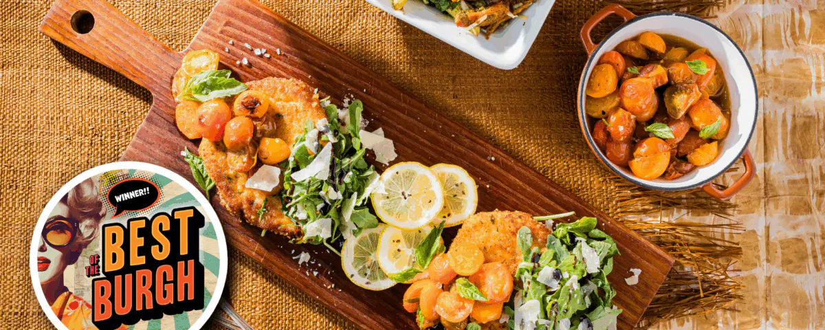 a bunch of food sitting on top of a wooden table