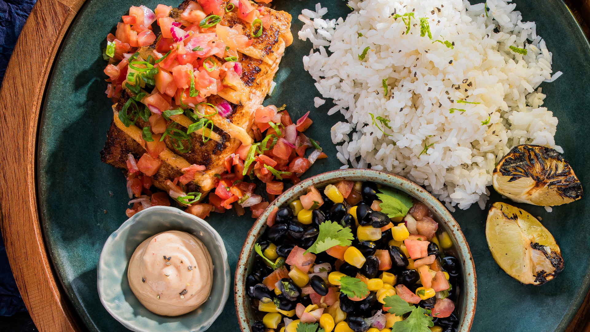 a plate of food with rice and salsa