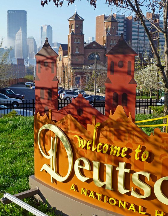 Close-up of a welcome sign for Deutschtown