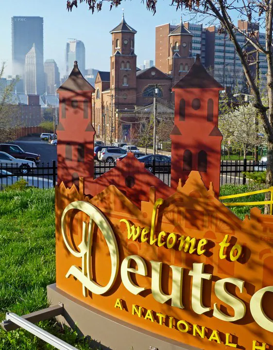 Close-up of a welcome sign for Deutschtown
