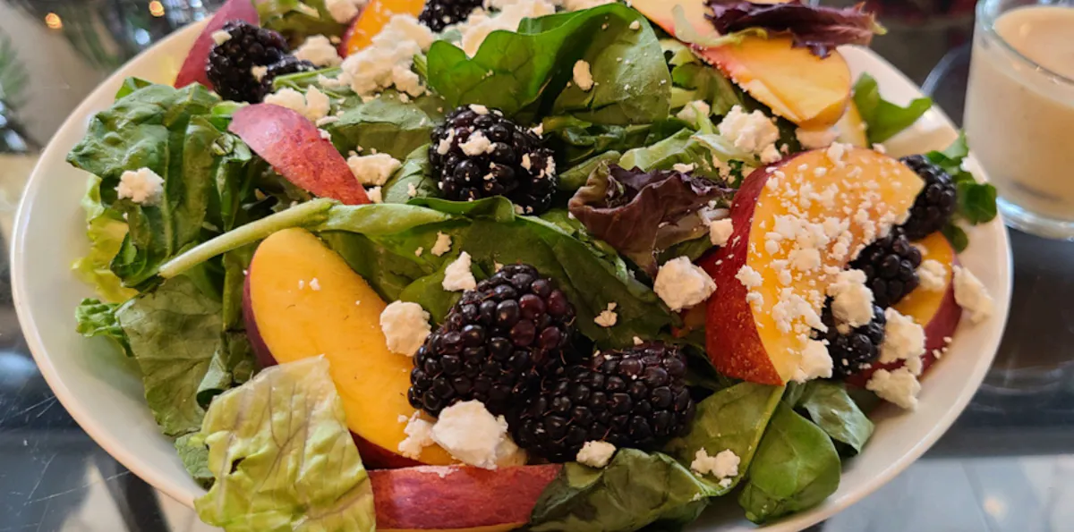 a bowl of salad on a plate